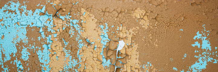Peeling paint on the wall. Panorama of a concrete wall with old cracked flaking paint. Weathered...