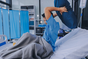Lonely man silhouette sitting on the bed feeling depressed and stressed in the dark bedroom, Depression and anxiety disorder concept