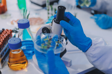 Fototapeta premium Team Asian scientists in a lab conducting food research using a microscope and lab equipment, showcasing innovation in food science and biotechnology