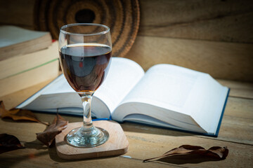 Books and wine glasses on the table