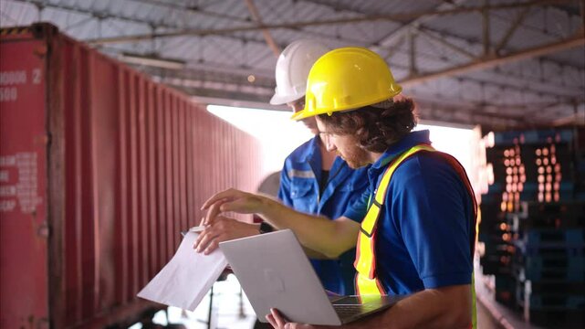 A bunch of warehouse workers are reviewing the list of items based on the documentation