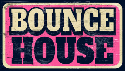 Aged vintage bounce house sign on wood