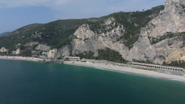 coastal mountainscape and limestone walls of Spiaggia del Malpasso in northwestern Italy