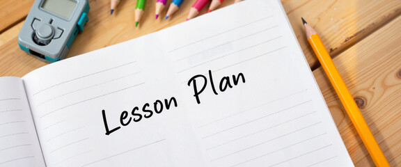 Open lesson plan notebook on teacher's desk, educational inspiration