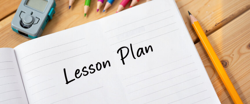 Open lesson plan notebook on teacher's desk, educational inspiration