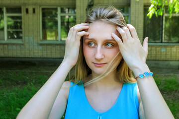 girl, 16 years old, blonde, straightens hair, standing, portrait, green-eyed, blue dress, building, school, yard, bracelet, smiling, teenager, summer, childhood, child,