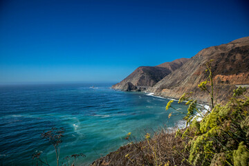 Bixby Creek Bridge seen in the distance along Big Sur’s dramatic coast