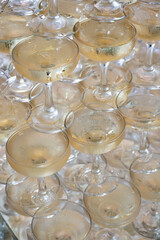 Stacked champagne coupes filled with sparkling wine