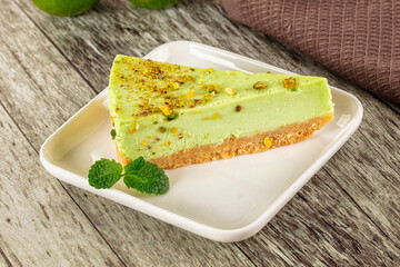 Green pistachio cheesecake served mint