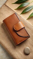 Vegan leather wallet displayed on neutral fabric background.