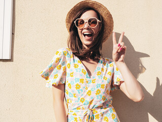 Portrait of beautiful smiling brunette model. Trendy female posing in the street background. Funny...