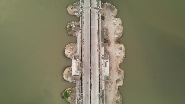 Aerial view of Pandansimo Bridge in Yogyakarta, the southern Java cross bridge is under construction. Adjacent to Baru Beach.