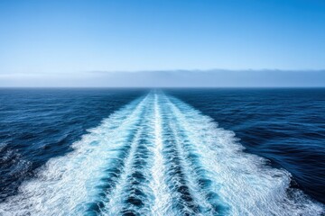 Ocean Waves and Wake Trailing Behind a Ship in Clear Blue Sea