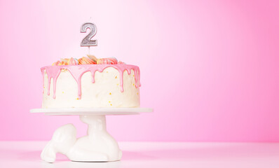A festive birthday cake topped with candle