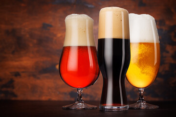 A selection of various beer glasses filled with different types of beer