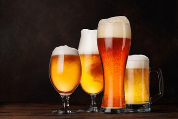 A selection of various beer glasses filled with different types of beer