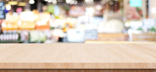 Table and blur background, Wooden counter over blur bokeh light background, Brown wood table top, shelf for food and retail shop, store product display backdrop, banner, mockup, template