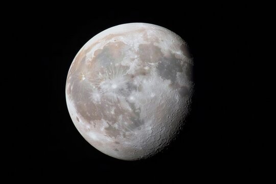 A large, round moon in the night sky. The moon is surrounded by a dark background. Concept of calmness and serenity, as the moon stands out against the black sky - Powered by Adobe