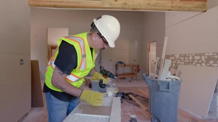 Builder are working with screw driver and various tools on an extensive house renovation project, showcasing their teamwork and exceptional skill at a busy construction site