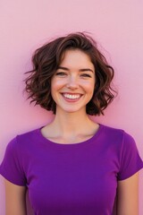 Fototapeta premium Woman with smile, against pink background, looking at camera.