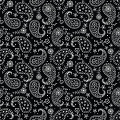 White paisley motifs on black seamless vector pattern