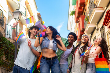 Young activists marching for lgbtq plus rights, using megaphone and waving rainbow flags