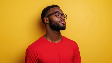 Fototapeta premium Happy young adult male posing for the camera with a casual smile.