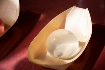 Mizu shingen jelly transparent mochi or raindrop water cake on bamboo leaf cup for korean people traveler buy eat in local cafe shop in Gamcheon Culture Village or Santorini of Busan city, South Korea