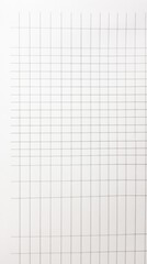 Overhead view of a blank white notebook page with a grid of lines creating a minimalist and organized aesthetic