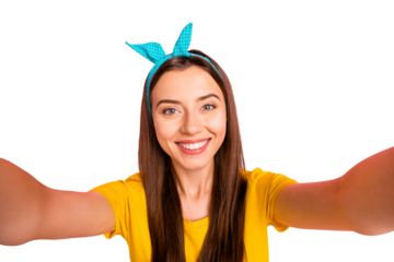 Close up photo of charming girl with beaming smile making photo wearing yellow t-shirt isolated over pink background