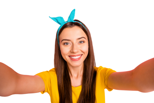 Close up photo of charming girl with beaming smile making photo wearing yellow t-shirt isolated over pink background