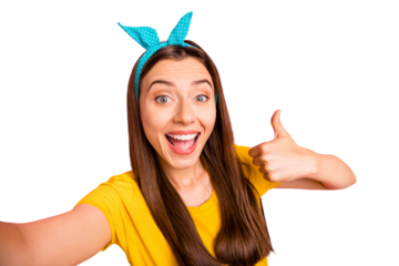 Close up photo of cheerful lady making photo showing thumb up wearing yellow t-shirt isolated over pink background