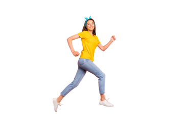 Full body photo of cheerful millennial running wearing yellow t-shirt isolated over pink background