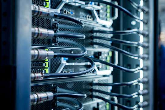 Close up of a data center and processing unit with cables and processors. Concept of hardware and connectivity for AI computing center - Powered by Adobe