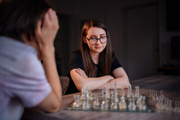 Intense Focus During a Chess Match Between Friends