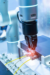 industrial machine and factory robot arm holding gigabit fiber optic terminal and cable,Smart...
