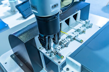 industrial machine and factory robot arm holding gigabit fiber optic terminal and cable,Smart...