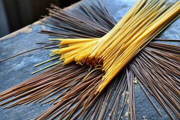 Minimalistic arrangement of raw spaghetti on rustic surface for culinary design