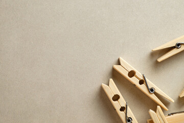 Handmade wooden clothespins arranged on a textured background for artisan crafts