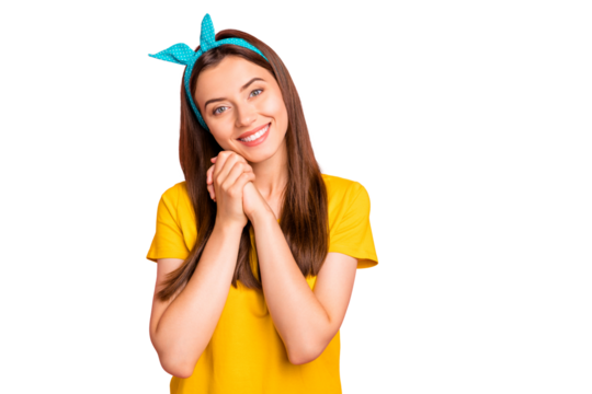 Portrait of pretty girl smiling looking at camera wearing yellow t-shirt isolated over pink background