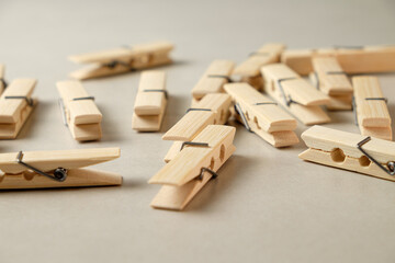 Exploring the rustic charm of wooden clothespins scattered on a clean surface
