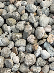 Background of pebbles stones. Stones on the beach. 