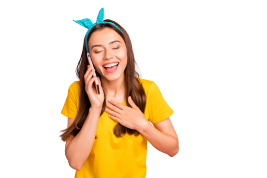 Portrait of cheerful person laughing with closed eyes touching her chest wearing yellow t-shirt isolated over pink background