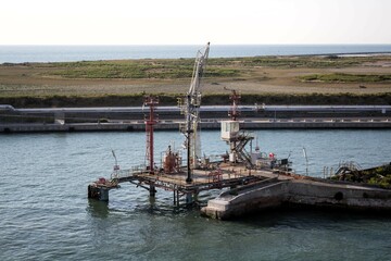 Fototapeta premium 2023.08.23 Livorno, Italy, commercial port, evocative image of the port structures