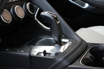 Close up car automatic transmission. Gear shift in new electric car. Selector automatic...