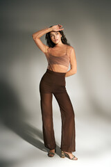 Embracing summer vibes with youthful elegance and modern fashion flair at a chic indoor setting