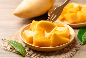Cube mango on wooden plate ready to eating, Tropical fruit in summer season