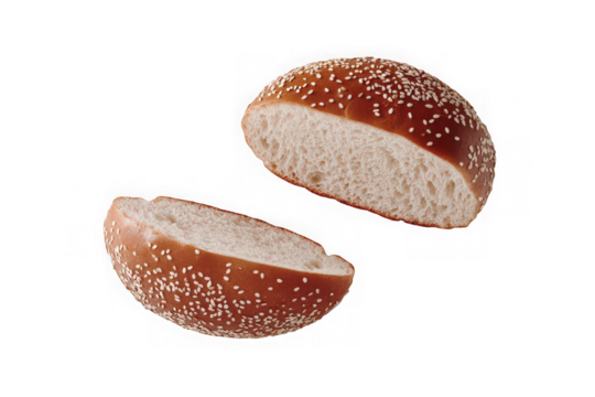 Sesame seed bun halves on white background.