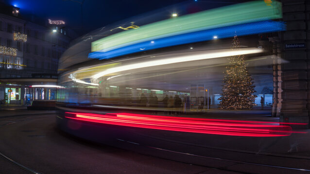 Tram Light Trails and Christmas Tree at Night in Zurich