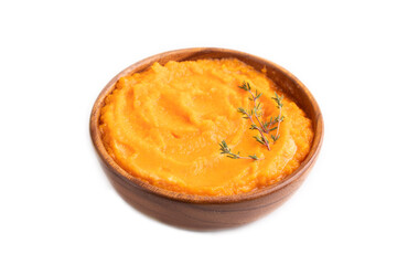 Sweet potato porridge in wooden bowl isolated on white. Diet, healthy eating. side view, close up